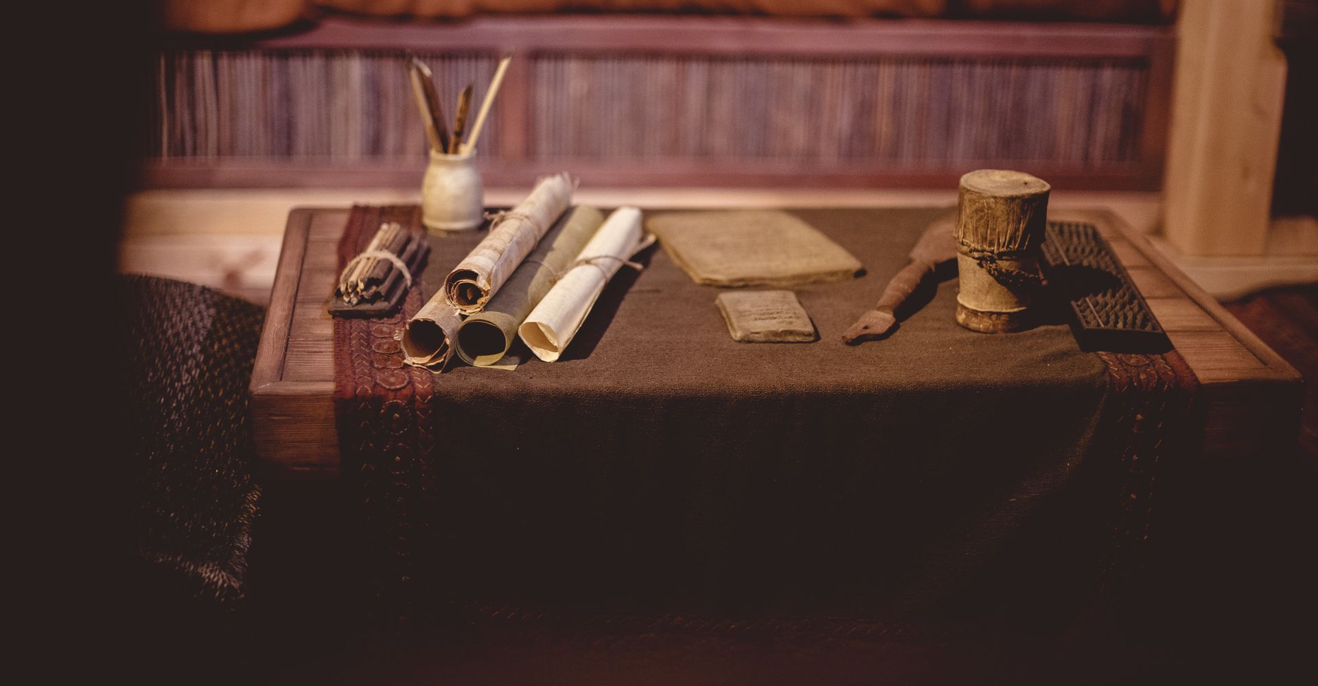 Rolled up old manuscripts on old wooden table